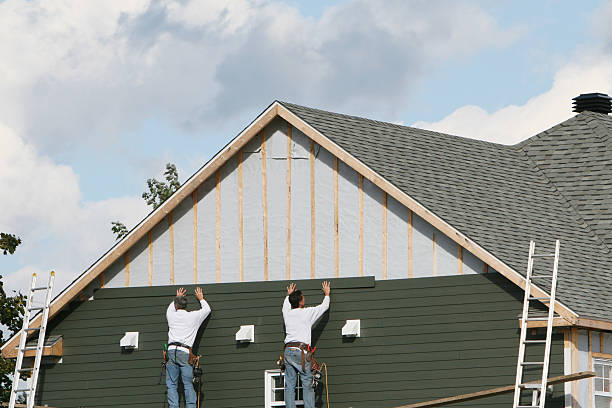 Professional Vinyl Siding technician working in Phoenix, IL